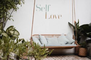 Self love image showing swinging chair and pictures, very relaxing atmosphere
